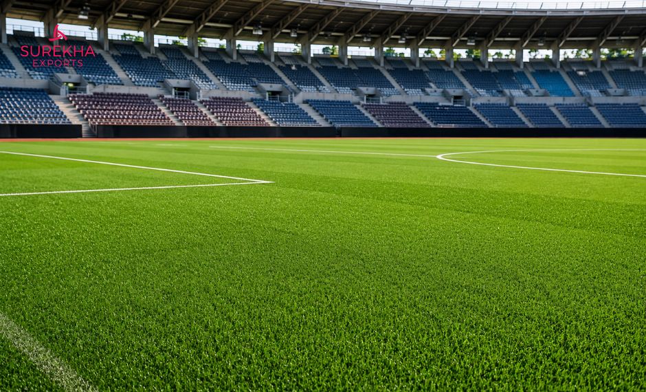 Professional team inspecting artificial turf quality at a sports field construction project stadium